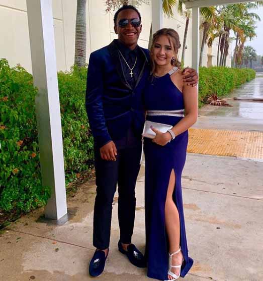 Miami Tip take a picture of her son with his girlfriend for Instagram post.